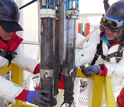 Scientists recovering an instrument from subglacial Lake Whillans.